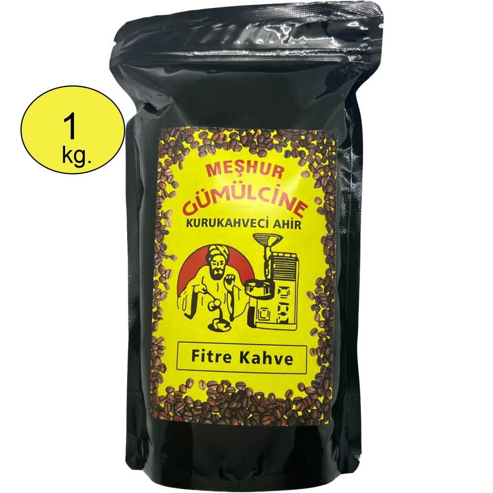 Siyah ambalajlı, sarı etiketli Meşhur Gümülcine Kurukahveci Ahır Filtre Kahve 1 kg paketi. Etikette geleneksel kahve kavuran bir adam, kahve değirmeni ve kahve çekirdekleri detayları bulunmaktadır. Ürünün sol üst köşesinde '1 kg' ibaresi yer almaktadır.